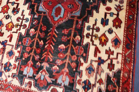 A Hamadan rug, 283cm x 120cm